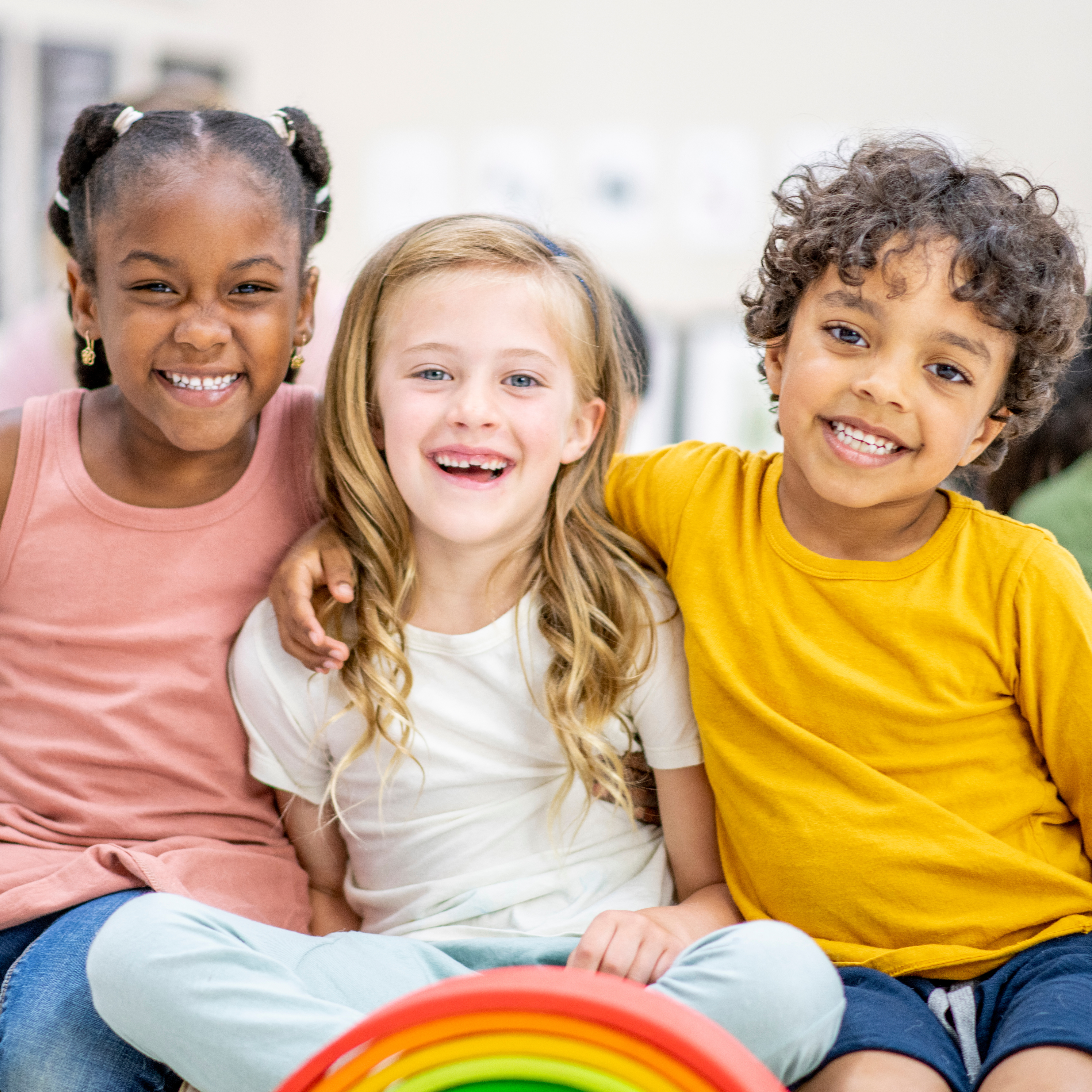 three children smiling
